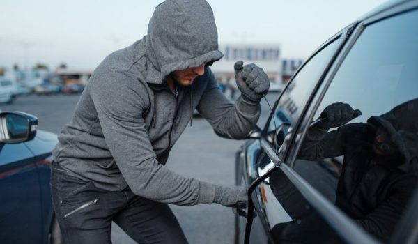 save-for-web-car-thief-breaking-door-lock-criminal-job-burglar-hooded-male-robber-opening-vehicle-parking-e1617050805959